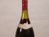 a bottle of wine that is sitting on a table