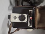 a camera that is sitting on top of a brown bag
