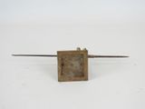 an old metal object on a white surface with a white background