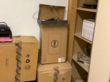 many boxes stacked on top of each other in a room