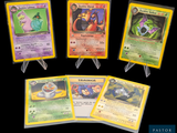 Quatre cartes Pokémon différentes sont représentées sur un fond noir