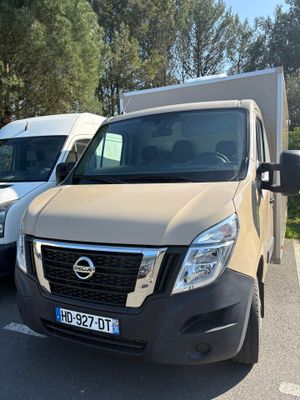 two vans parked next to each other in a parking lot
