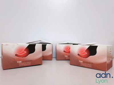 three boxes of foot care products sitting on a table