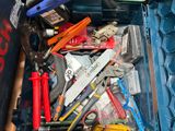 a box full of tools that are sitting on the floor
