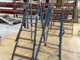 many ladders that are sitting in a warehouse