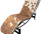 an image of a chaise lounger with a cow hide cover on it