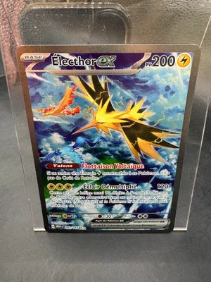 a close up of a box of pokemon cards on a table