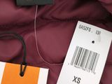 an image of a jacket with a tag attached to it