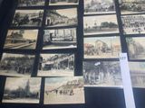 a lot of old black and white pictures on the table