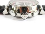 a close up of a watch on a white surface