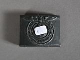 an image of a small black box with a white button