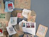 a pile of old stamps and envelopes on the floor