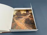 an open book with a picture of a windmill on it