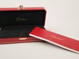 an image of a red box with a watch inside of it