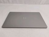 a laptop that is sitting on a white surface