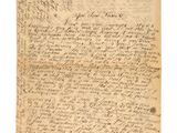 une vieille lettre écrite à l'encre noire sur un bout de papier