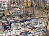 a large metal cage filled with lots of books