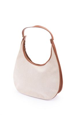 un sac à main blanc avec des anses marron sur fond blanc
