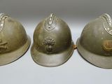 three helmets that are sitting on a table