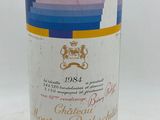 a bottle of wine that is sitting on a table