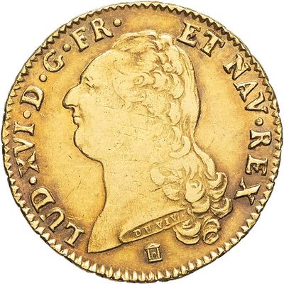 a close up of a gold coin with a woman ' s head