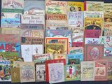 many children ' s books on display on a table