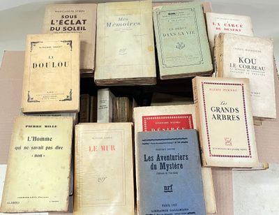 a lot of books that are sitting on a table