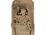 an image of a statue of an angel holding a shield