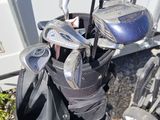 a close up of a golf bag with a golf club in it