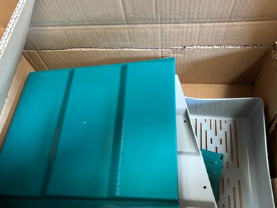 a box with a blue tray inside of it