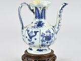 chinese blue and white porcelain teapot on wooden stand
