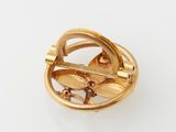 an image of a gold plated ring with a bird on it