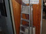 a ladder leaning up against a wall in a room