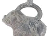 a gray vase with a bear on it on a white surface