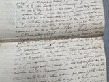 a close up of a piece of paper with writing on it