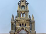 an old wooden model of a church with a steeple on top of it