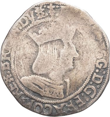 gros plan d'une pièce de monnaie sur laquelle figure une tête d'homme