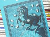 a blue book with a picture of a horse on it