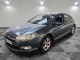 a grey citrole is parked on a checkered floor