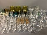 a lot of glasses that are sitting on a table