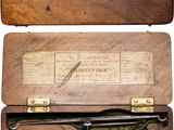 a wooden box with a clock inside of it