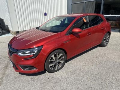 a red car parked in front of a building