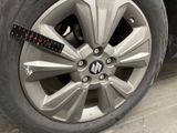 a measuring tape on the rim of a car