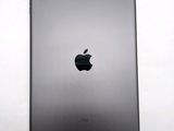 an apple ipad is shown on a white surface with a black apple logo
