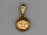 an image of a small gold ball with a star on it