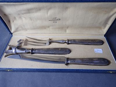 three silverware items in a blue case on a blue surface