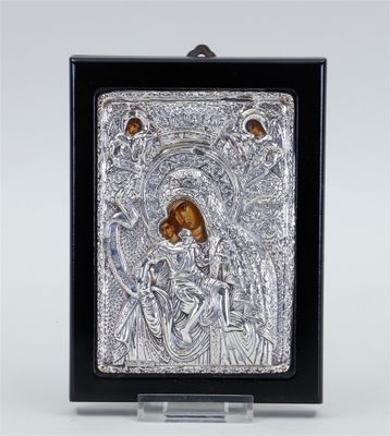 a silver and gold icon of the virgin mary and child jesus
