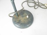 a blue lamp that is sitting on a white table