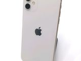 an apple iphone is sitting on top of a stand on a white surface