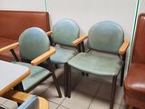 four chairs and a table in a waiting room